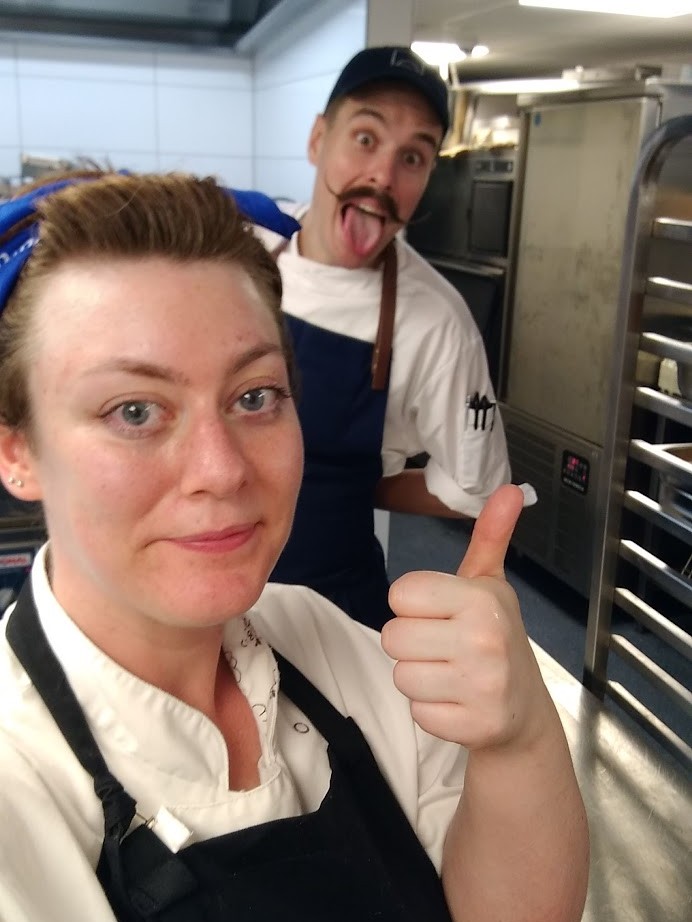 Lucie at work with another chef goofing around