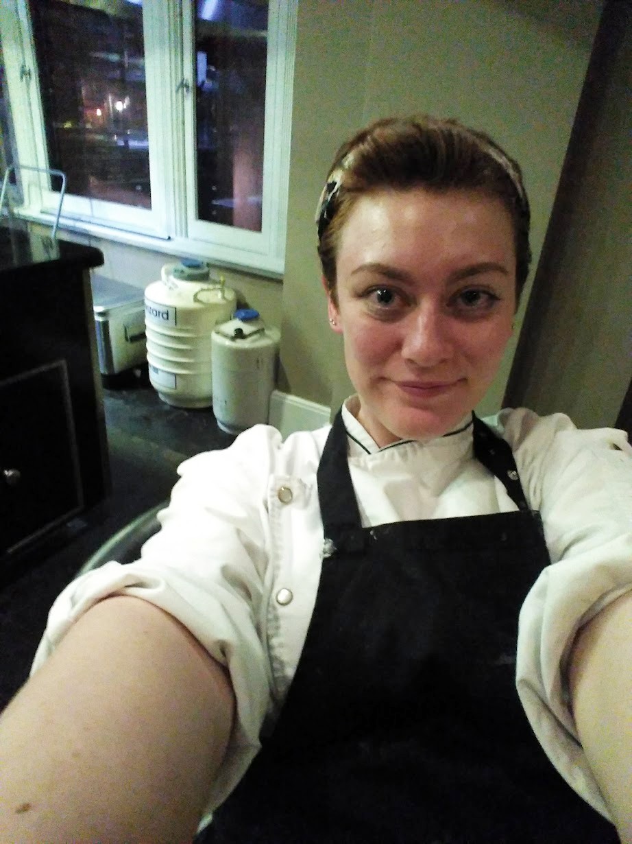 Lucie at work smiling while taking a selfie